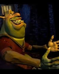 An early computer-animated Shrek smiling and gesturing in a dark forest